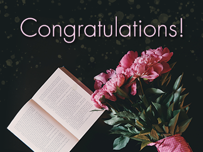 Congratulatory photo of a bouquet and a book